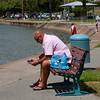 HippyfromOz > Sunday 9 March 2008 - Found this guy sitting by the waterfront at Manly, a mobile phone in one hand and instruction leaflet in the other.  I can emphasize with his dilemma.  He was so engrossed he didn't realise I captured his photo.