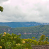 HippyfromOz > Sunday 16 March 2007 - Looking out over Lamington National Park from our cabin at Binna Burra.
Binna Burra is the phrase in the local Aboriginal language meaning "where the beeches grow".
Flowers in the foreground are Grevilleas - native to Australia.