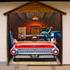 HippyfromOz > Saturday 5 April 2008 - We went to the local Hogs Breath Cafe for a meal last night - this is the painting on the outside wall.  The thing that amuses me the most is the black tyre marks on the footpath that continue into the painting.  The nicest thing about the cafe (its really a restaurant) is that you can sit on the outside deck overlooking the water.  The food is great.
